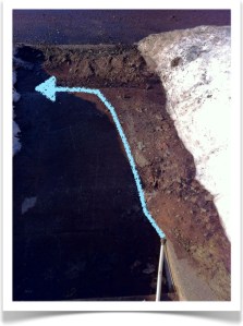 House outlet at a lower elevation than the basement floor, with a blue arrow indicating water flow.