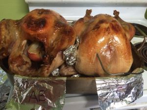 Turkeys after roasting. The "fancy" brine (left) seemed to turn out darker than the bird brined with the simple recipe (right).