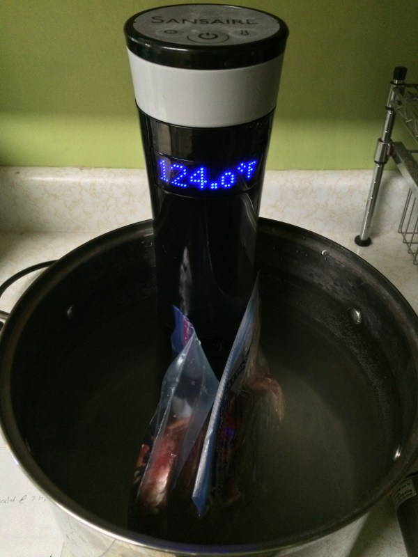 Steaks in water bath sealed inside both a regular freezer bag bag (left) and vacuum sealed bag (right).