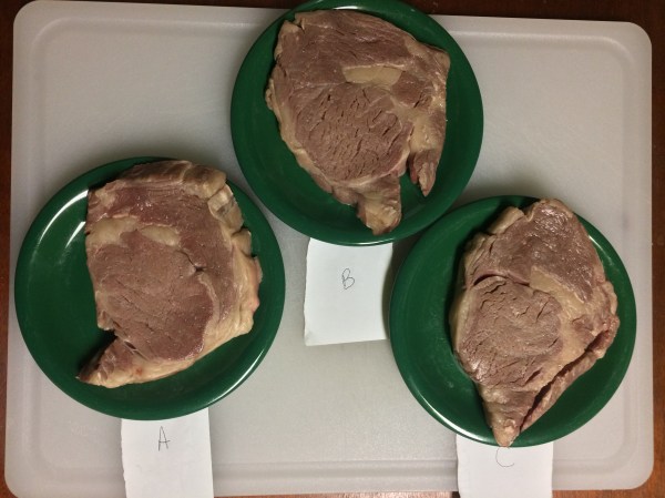 Unseared steaks after being patted dry.