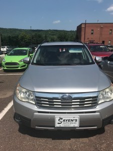 silver Subaru Forester parked in the sun