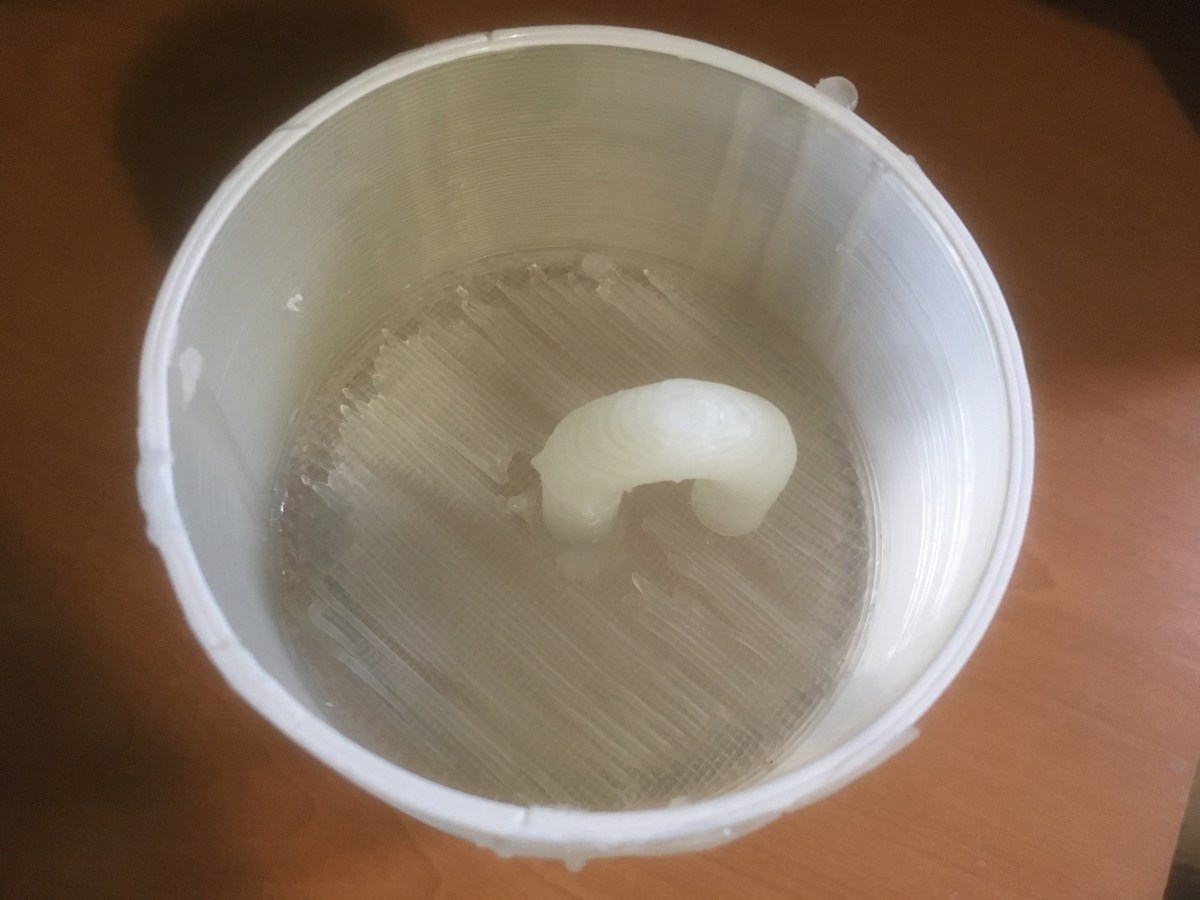 Wax patched siphon pipe.